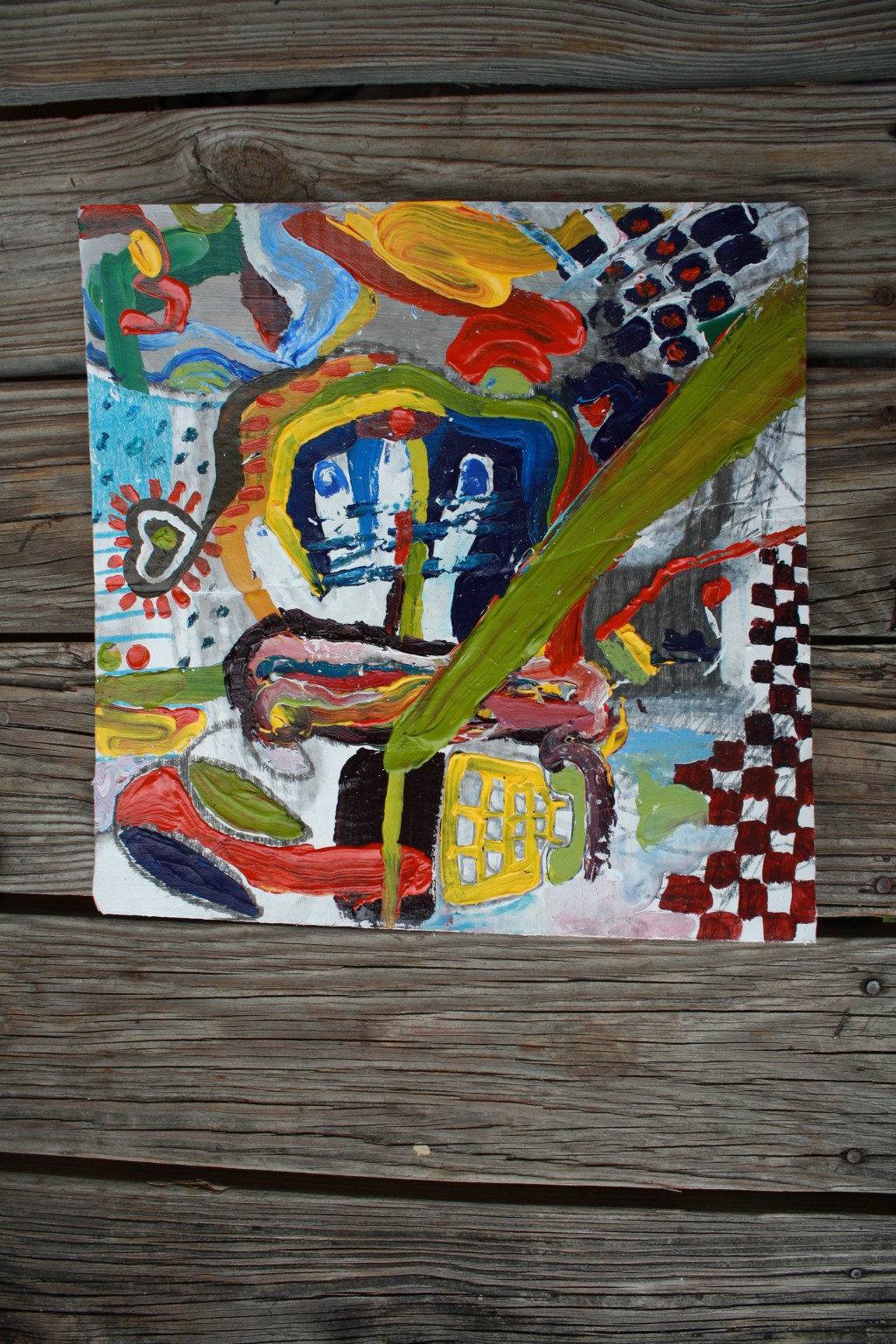 Painting with colors and paint that got wet because I left it in the rain.  Acrylic and charcoal and paper and dirt on cardboard.